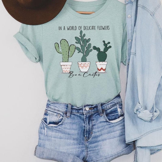 In A World Full Of Flowers Be A Cactus Unisex Tee