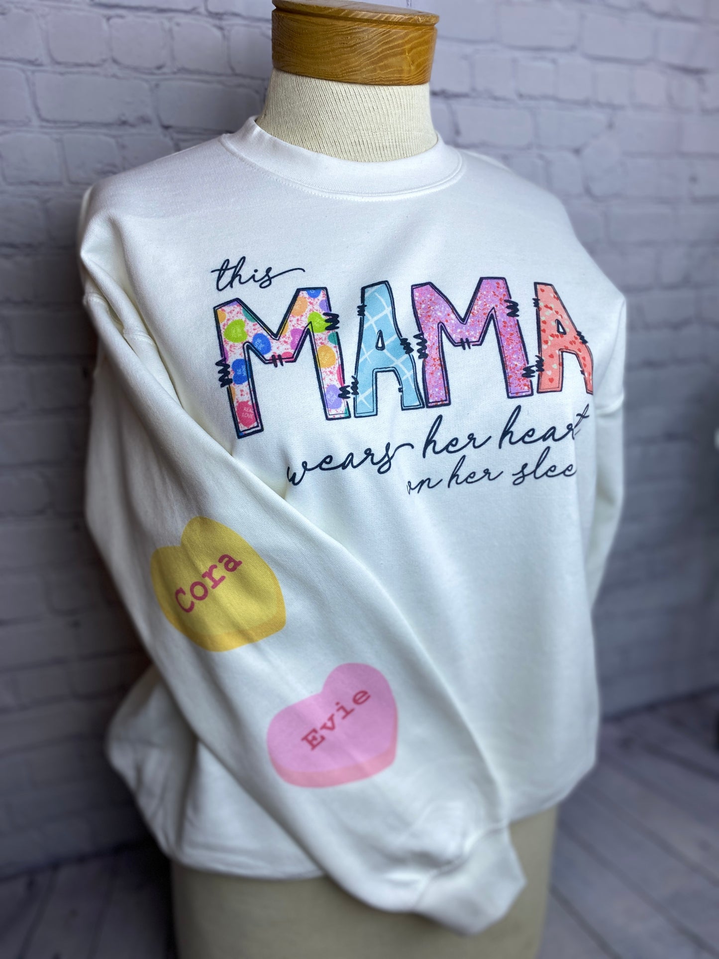 This Mama Wears Her Heart(s) On Her Sleeve Unisex Crewneck Sweatshirt